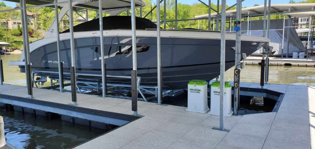 Floating boat elevator with a Cobalt cruiser docked on it