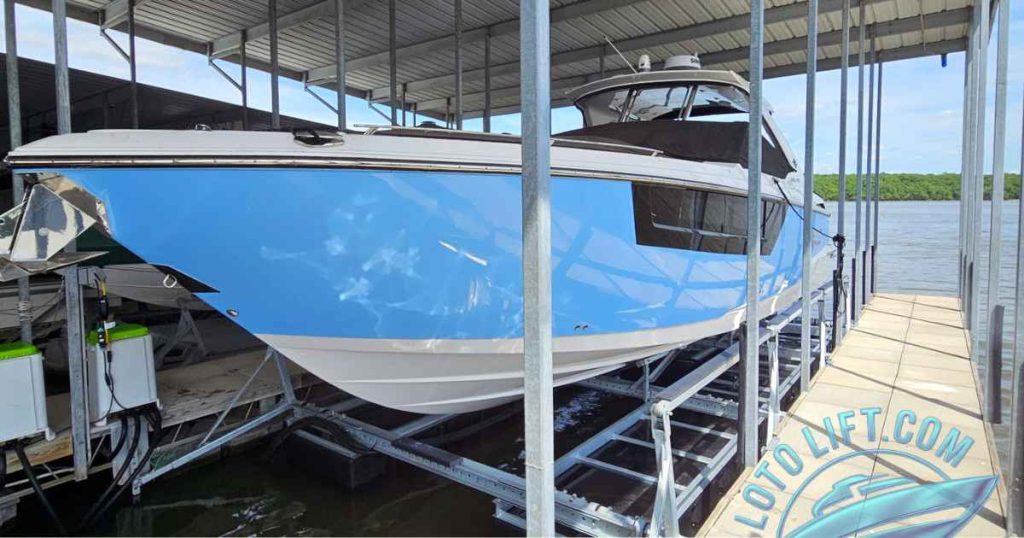 13,500 lb pneumatic boat lift holding a blue cruiser at Lake of the Ozarks Camdenton MO by LOTO Lift
