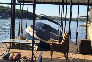 A boat lift problem causing uneven boat support as the boat sits slanted on the lift