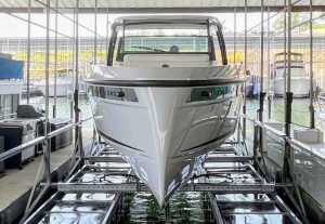 Professional pneumatic boat lift installation at Lake of the Ozarks holding a luxury boat safely in a covered slip - LOTO Lift Camdenton MO