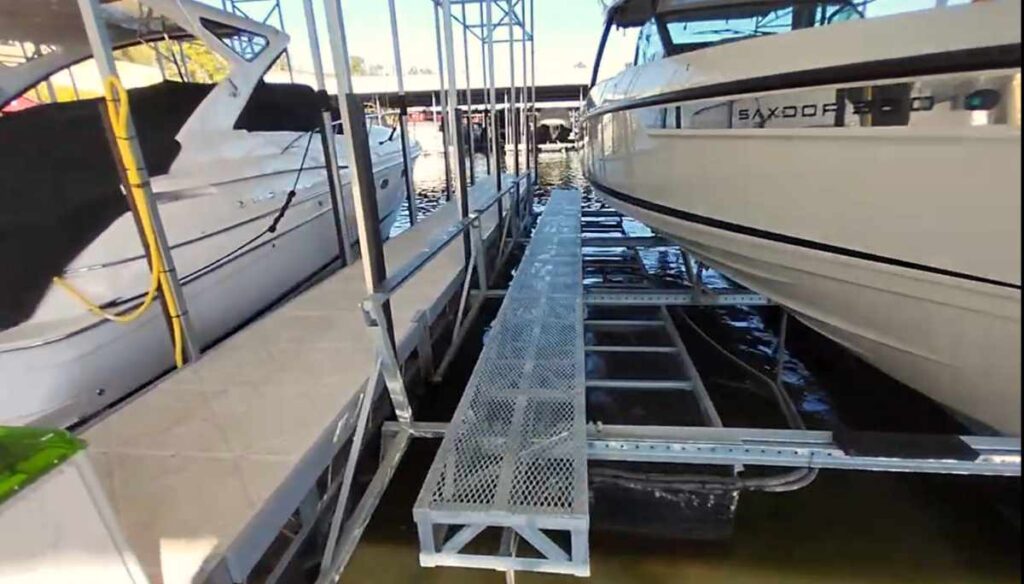 Custom steel mesh walkway on a LOTO Lift pneumatic boat lift at Lake of the Ozarks, providing safe walk-around access for maintenance and boarding.