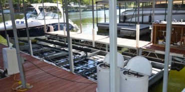 A new installation of a shallow water boat lift in a covered dock at Lake of the Ozarks.